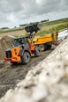 Wheel Loader dropping dirt,New Hitachi working in field,Hitachi Loader inside working,New Loader moving dirt in yard